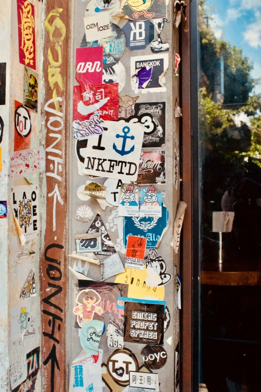 various stickers are attached to the side of a door