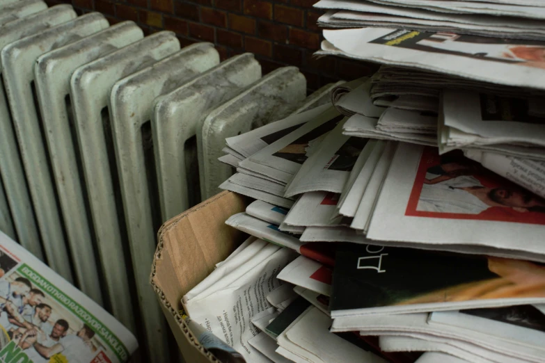 many newspapers are stacked over to read them