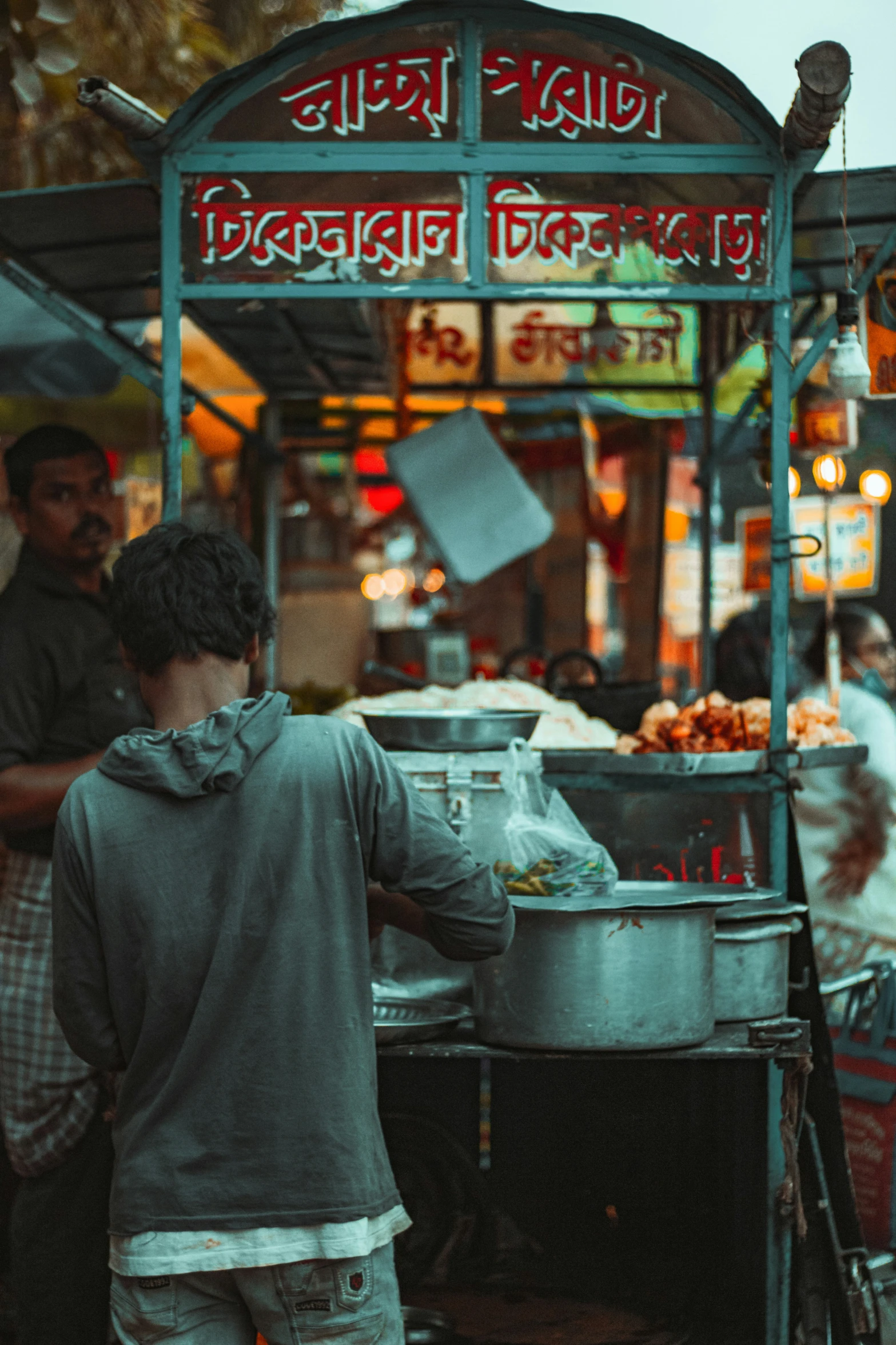 a man getting food out of a metal bin