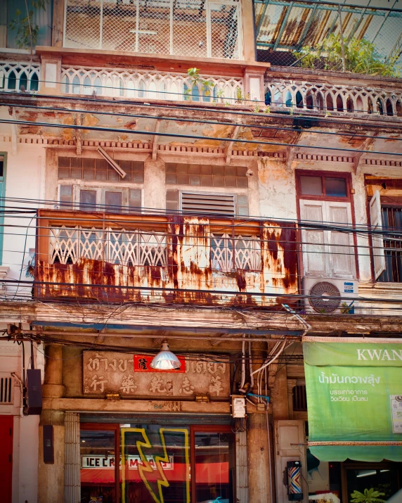 an old wooden balcony with iron bars