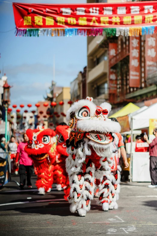 a group of people wearing costumes and holding onto poles