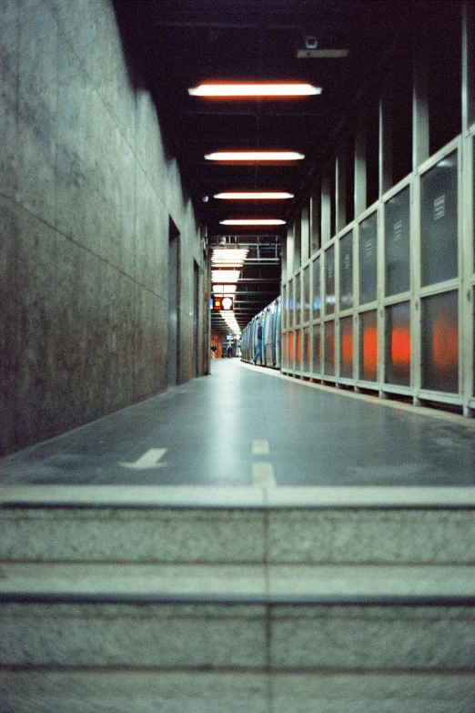 the hallway at a facility with many windows