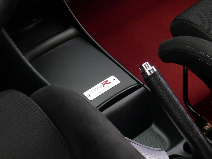 a red carpeted room with leather trims and a silver padlock