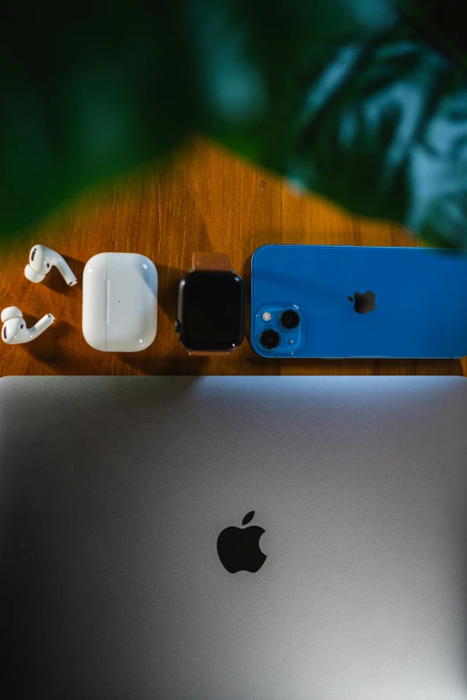 a table with three apple products on it