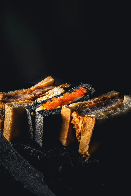 a few pieces of bread sit on top of each other