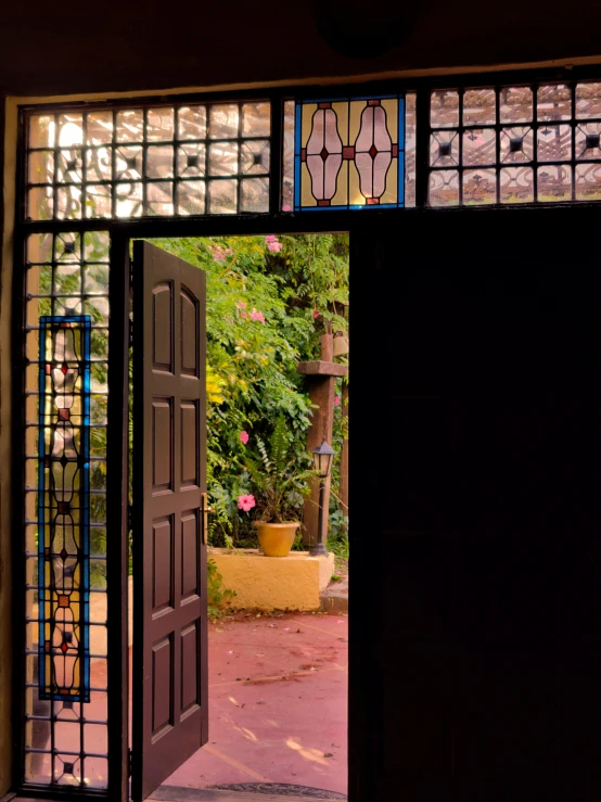a view of an iron door leading out into the patio