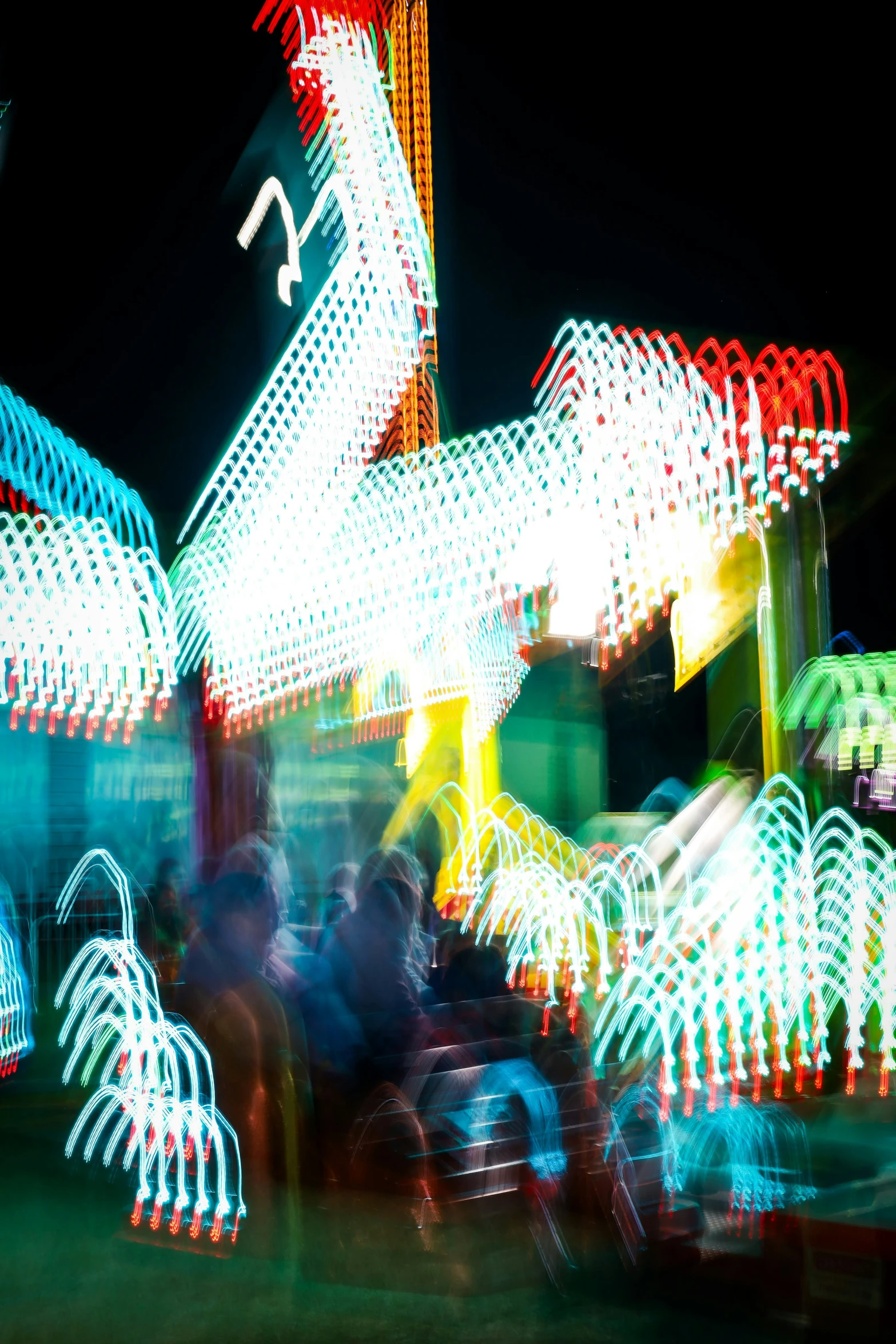 a blurry view of an amut park at night