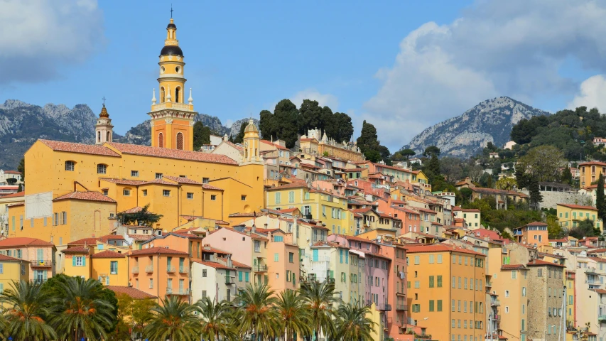 a view of a town with mountains in the background