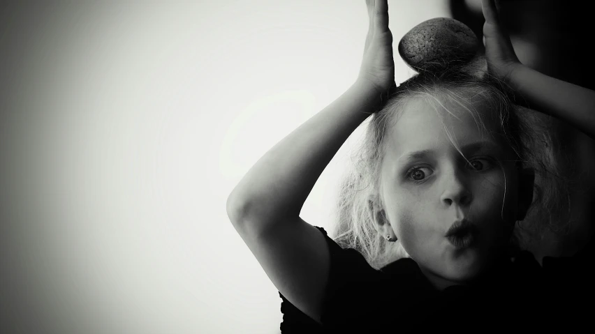 a woman holding up a bunch of hair