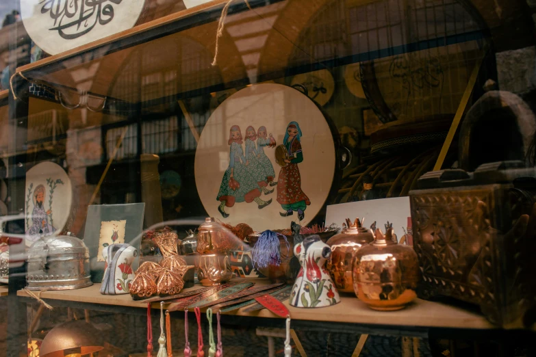 an assortment of decorative vases in a window