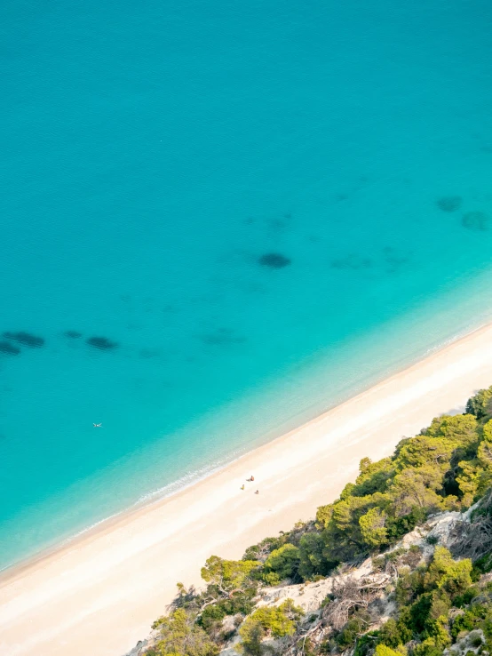 the ocean coast has a sandy beach on the other side