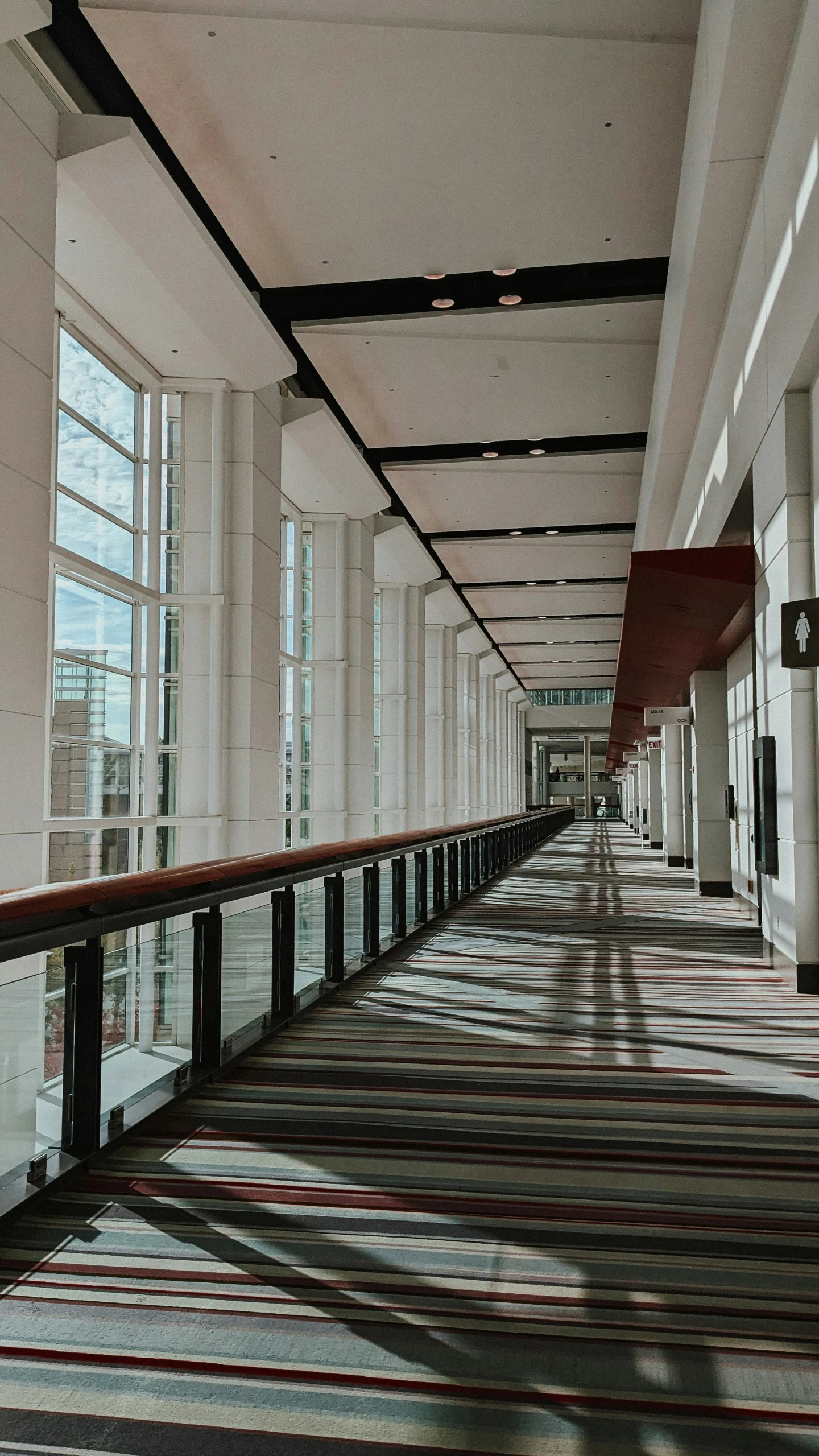 a long hallway with several windows next to each other