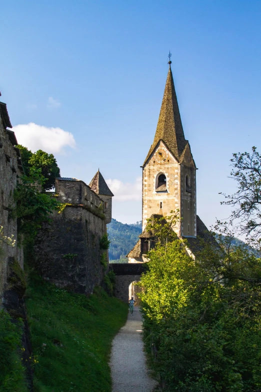 an old castle with two towers is seen on a clear day