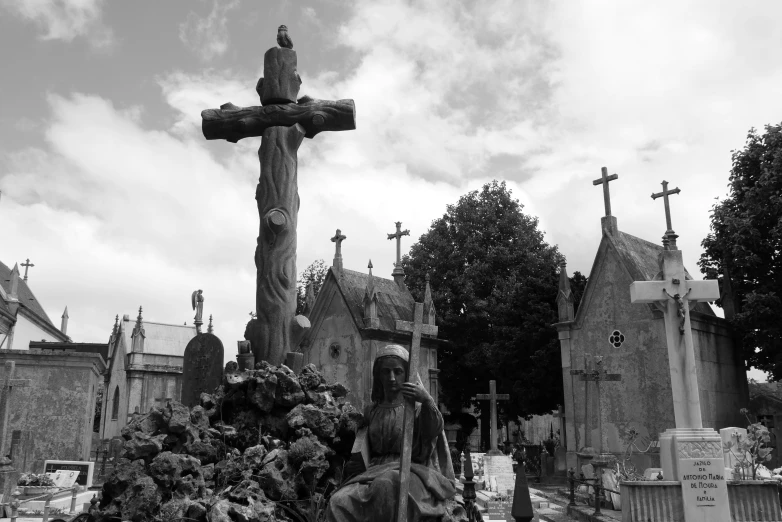 a group of people are walking around in a graveyard