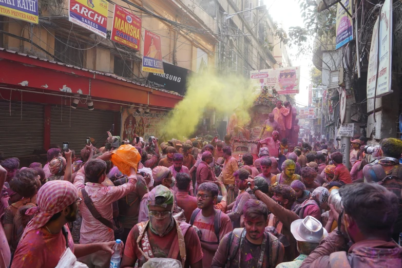 several people are celeting and holi dance during the festival