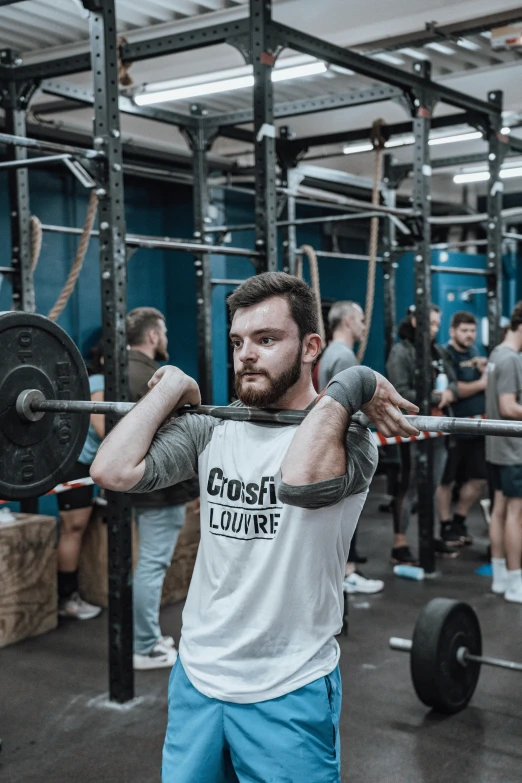 the men is in the gym exercising on the power plates