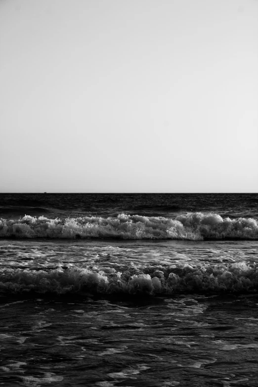 there is a surfer on a black and white picture