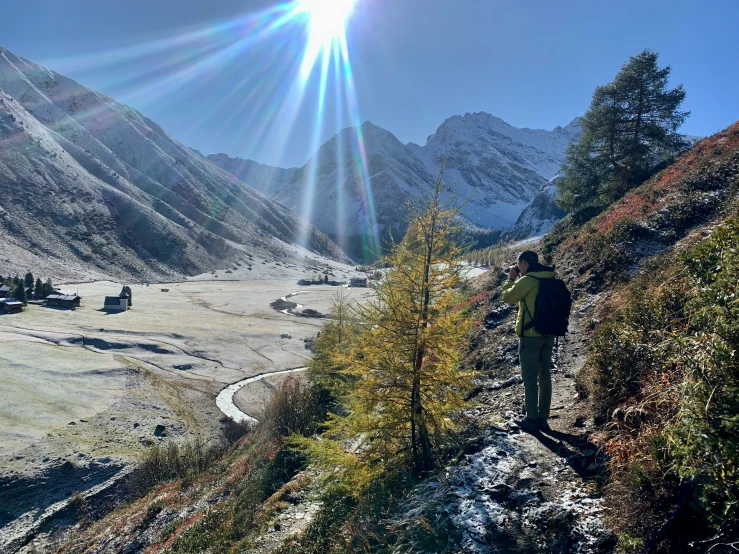 a person hiking up the side of a hill