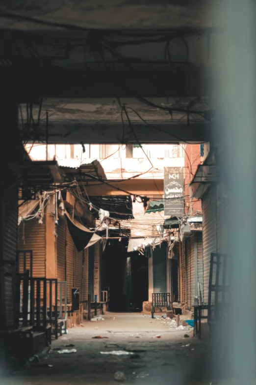 an alley way with some clothes hanging on it