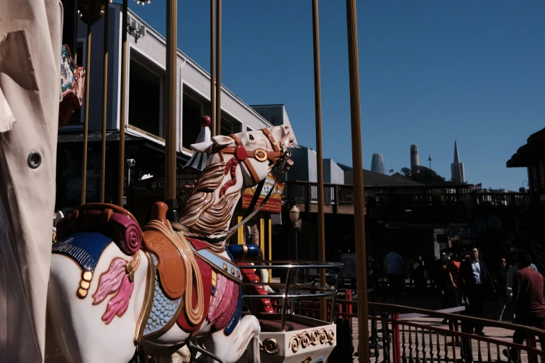 an amut park with colorful merry go round horses