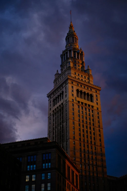 a tall clock tower sitting below a cloudy sky