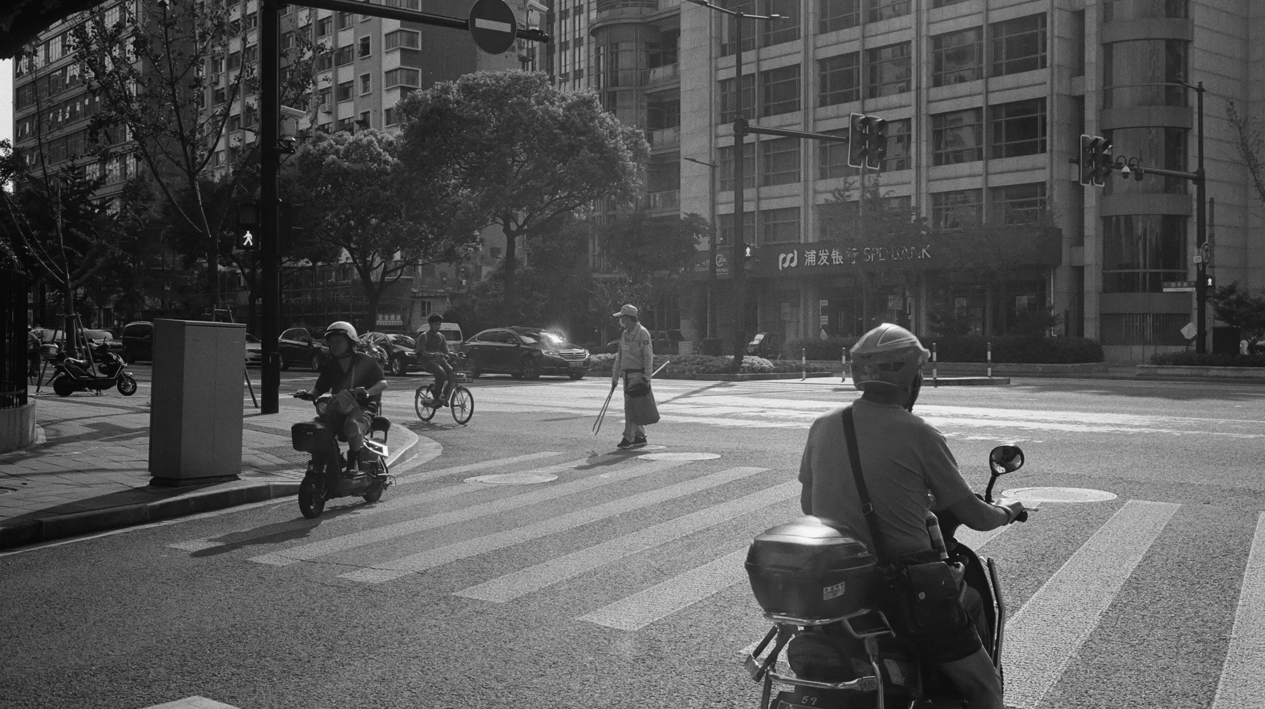 person in a wheel chair on a busy street