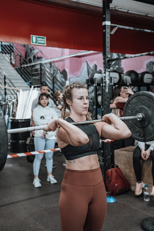 people are in the gym doing crossfit exercise