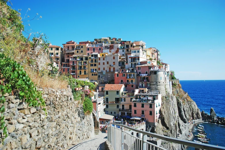 a view of a scenic landscape showing a village and its cliffs