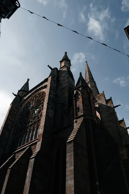 looking up at an old church with its spires