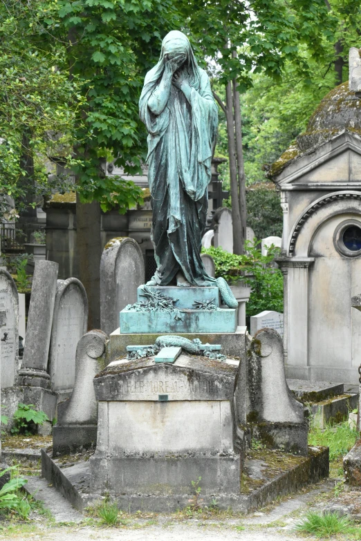 the cemetery contains statues of a woman and a child
