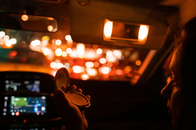 someone taking a po of the dashboard light inside a vehicle