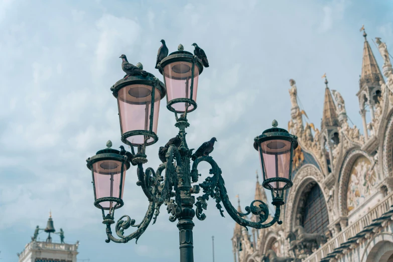 a lamp that is hanging on the side of a building