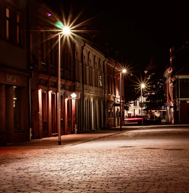 an empty street has been lit by a bright light