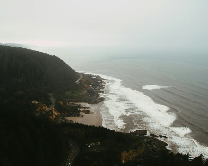 a small beach with waves coming in from the water