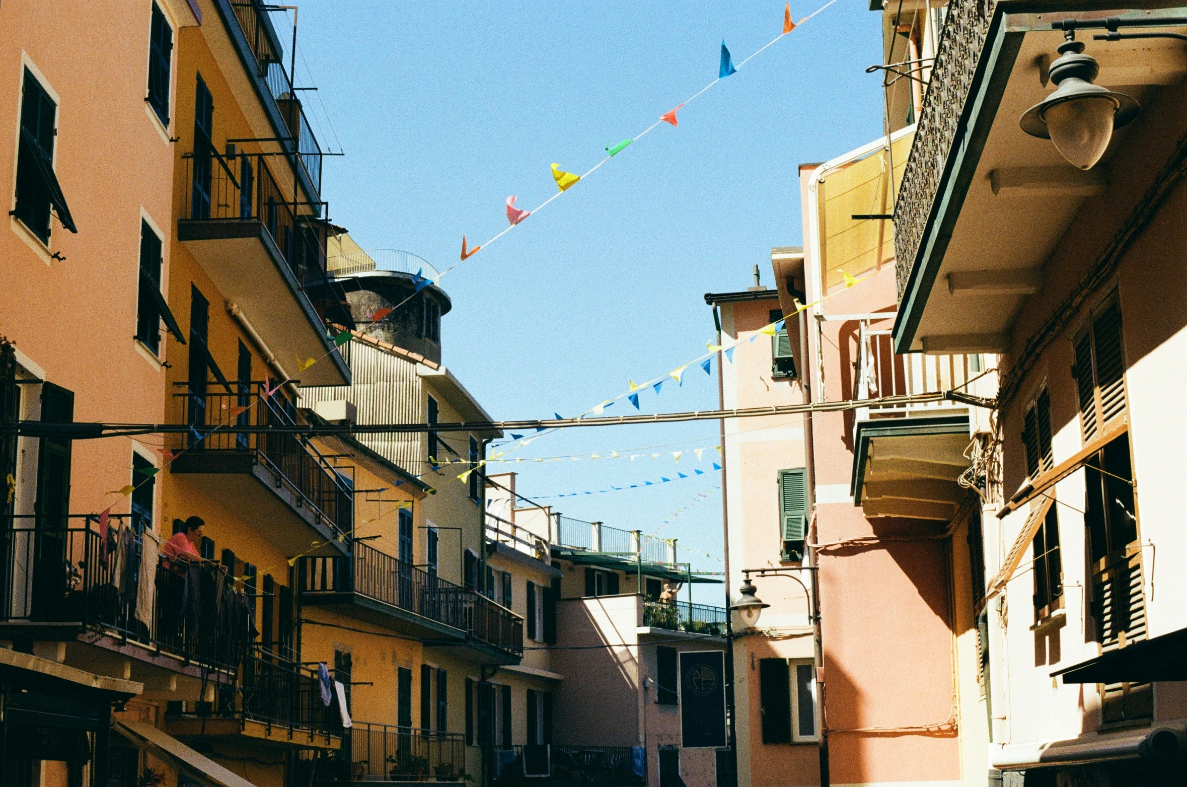 a city street lined with lots of yellow buildings