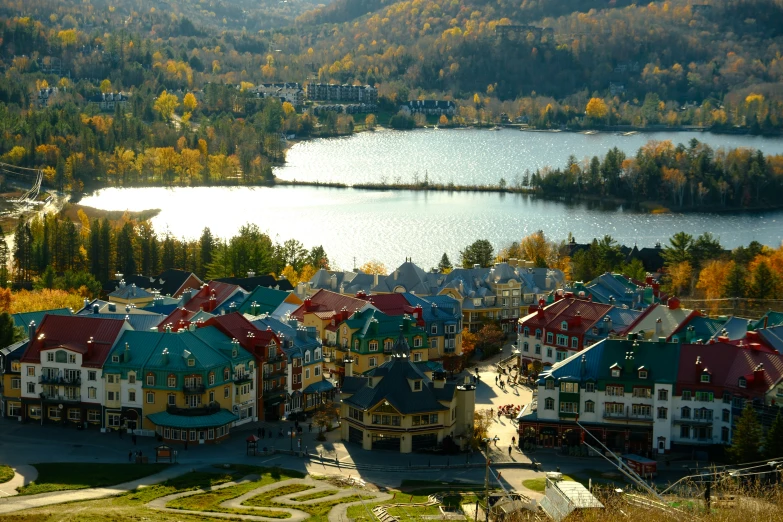 colorful houses on a hillside above some water