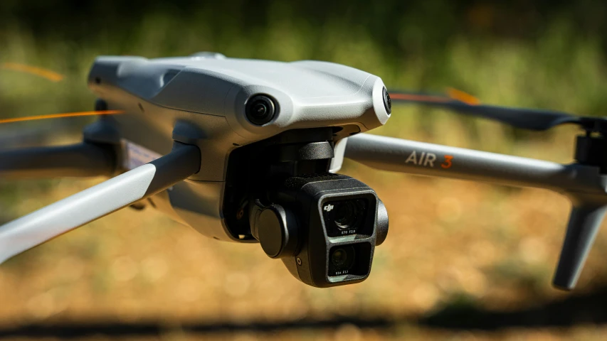 a small, white quad propeller aerial camera