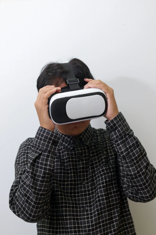 man in black shirt and white blind covering his eyes