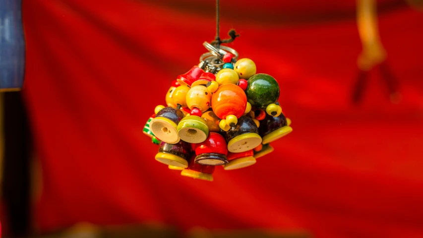 a bell decoration made out of plastic toys