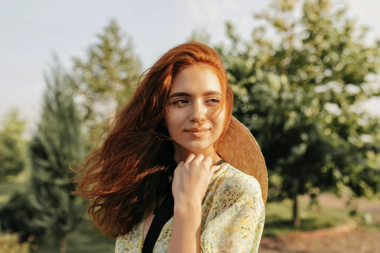 a woman with curly hair posing for a picture