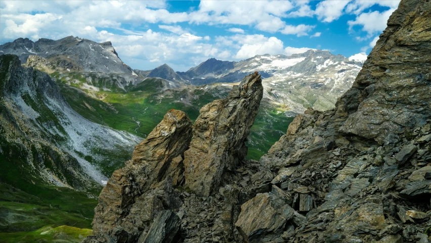 a rocky mountain in the middle of some mountains