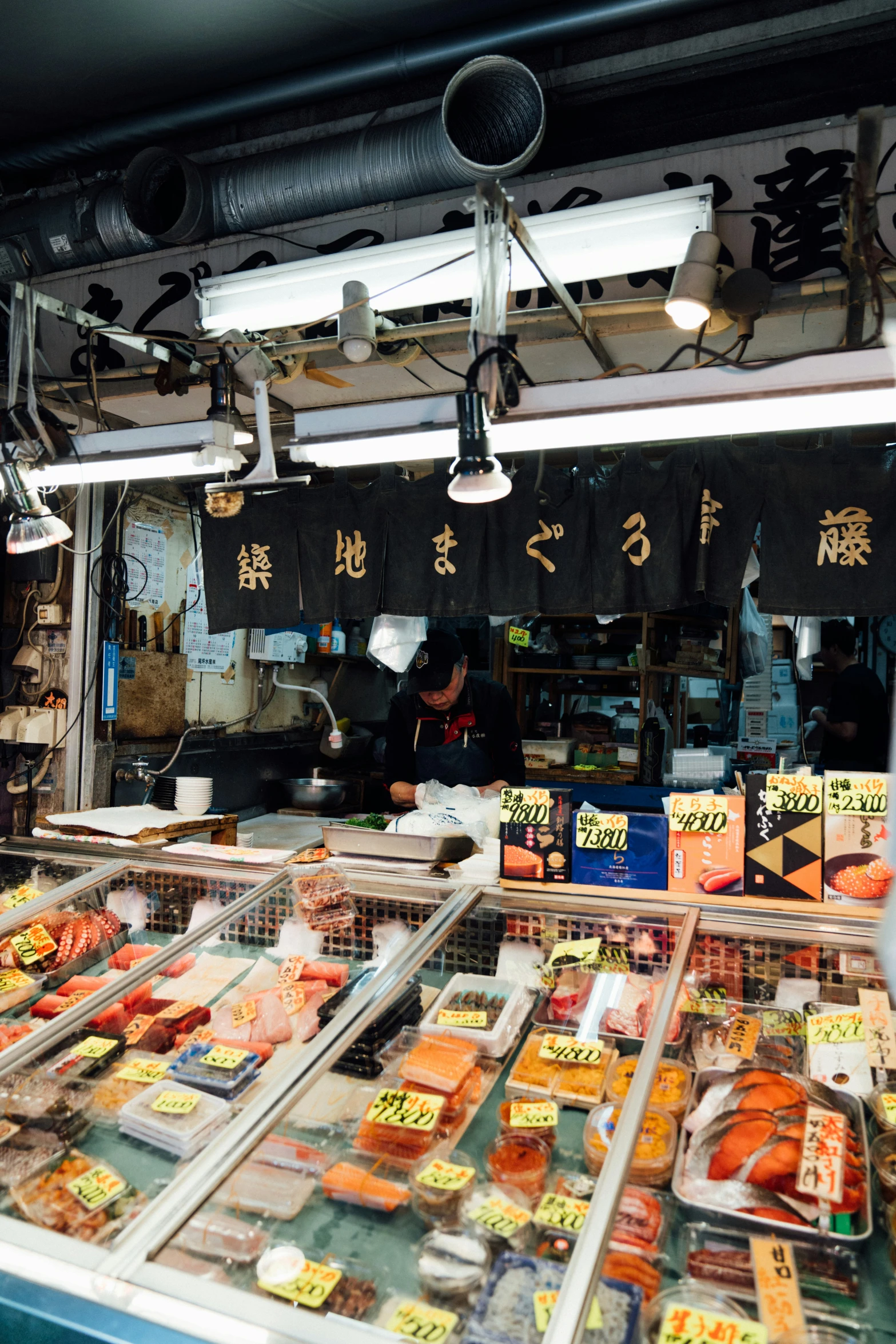 a view of the inside of a restaurant with different foods in it