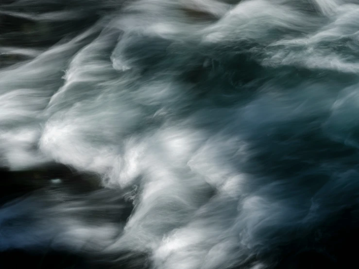 a long exposure of ocean waves coming toward shore