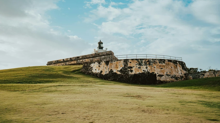 the ruins are sitting on the side of a hill