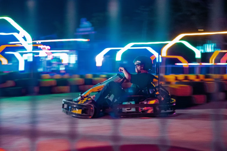 a man riding on the back of a car