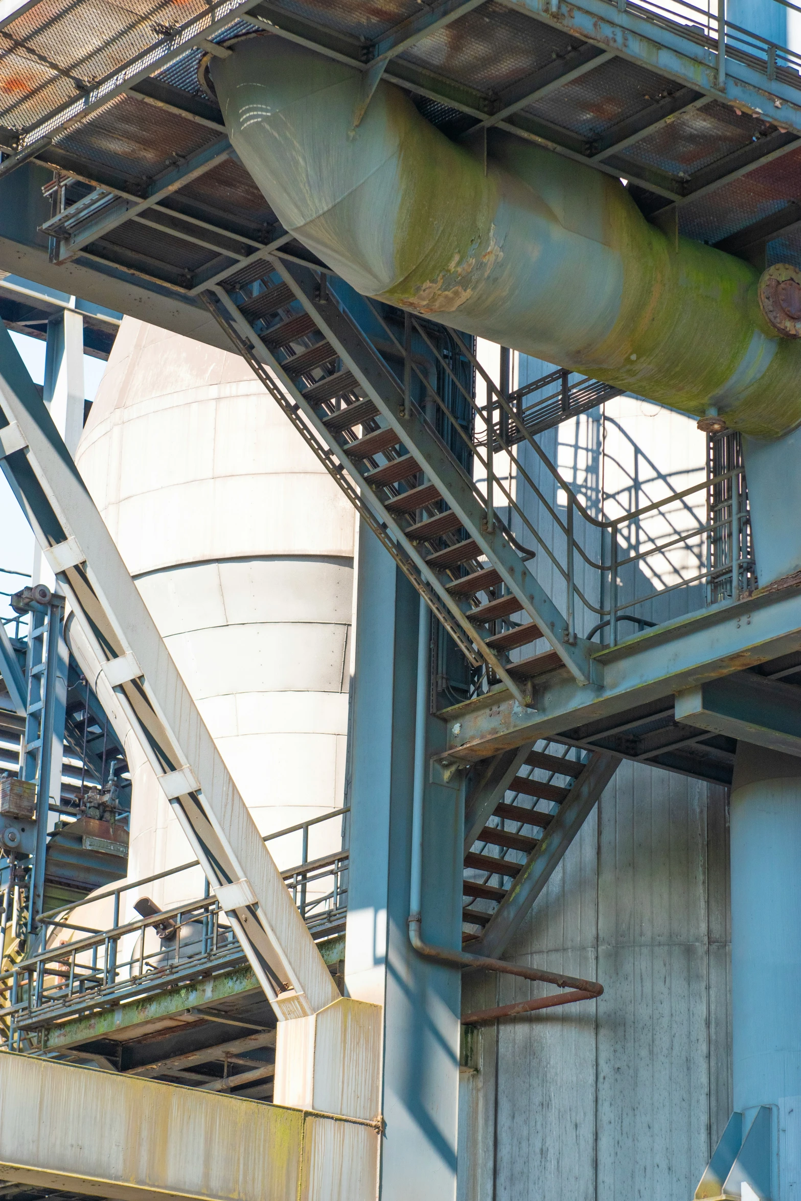 the interior of a building with steel stairs