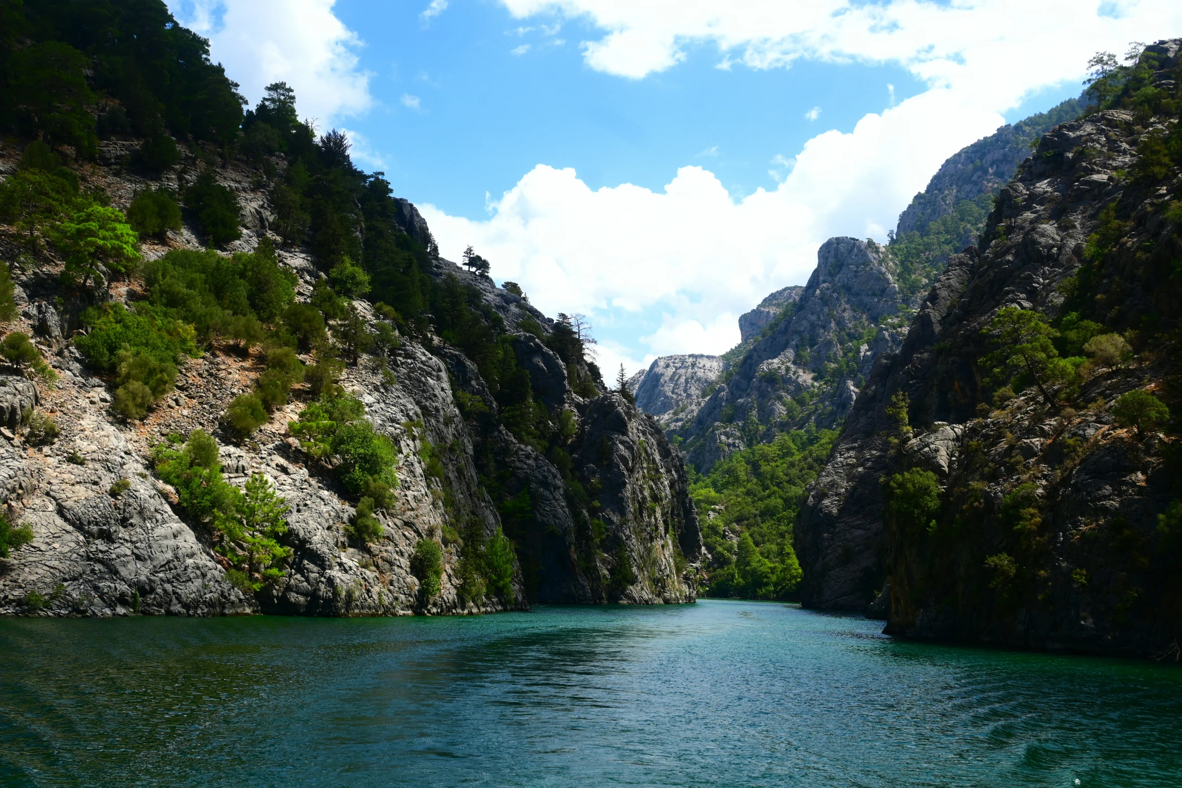 an open - mouthed area with the blue water flowing