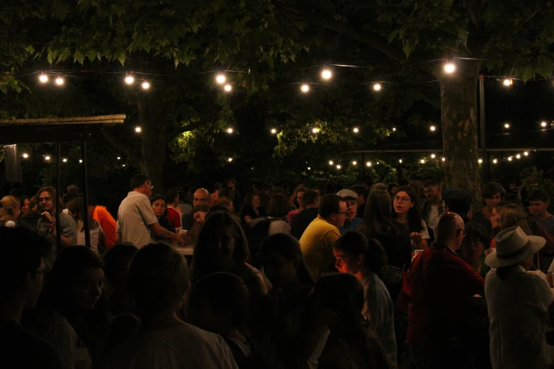 a crowd watches a couple at an event