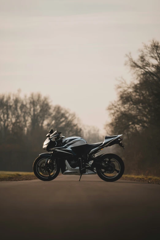 there is a motorcycle that has parked on the road