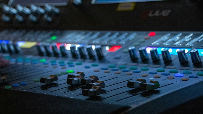 an electronic sound board with the focus lighting on the controls